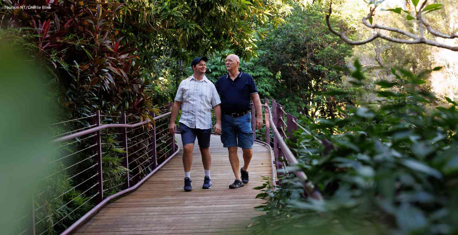 two men walking in garden